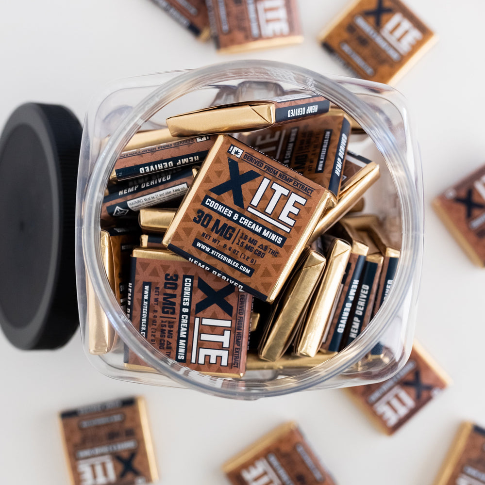 a plastic container filled with cookies and cream minis 30mg by xite
