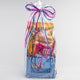 wrapped gift bag of various xite edible products with happy birthday message
