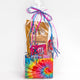 wrapped gift bag of various xite edible products with tie dye packaging